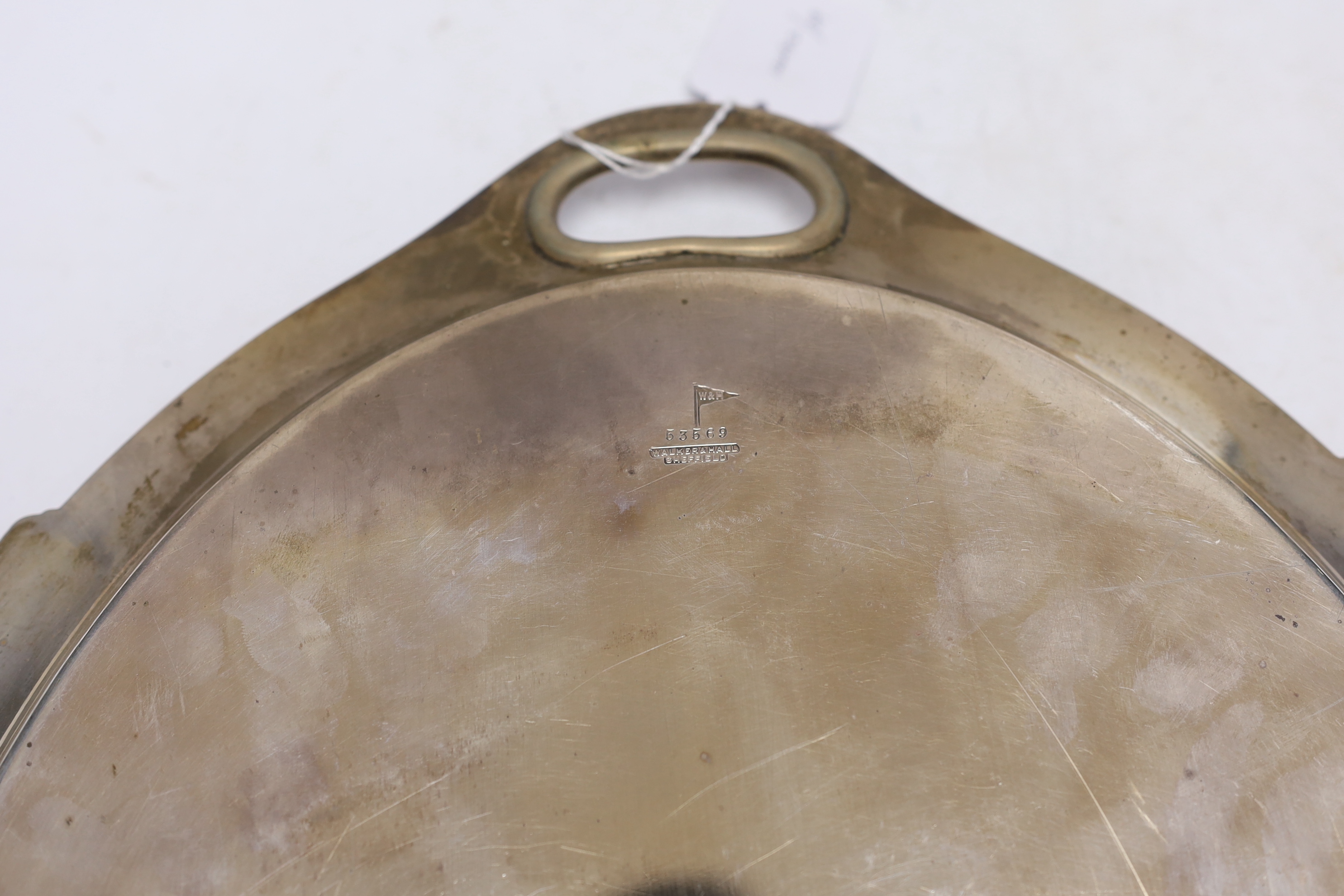 A George V silver oval presentation tea tray, with inset handles, Walker & Hall, Sheffield, 1935, 49.4cm, 54.2oz.
